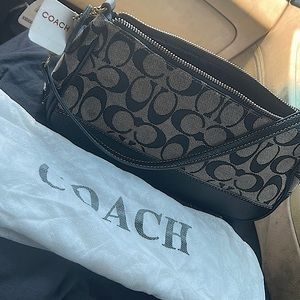 AUTHENTIC Coach clutch purse. NEVER USED. With dustbag and tags.